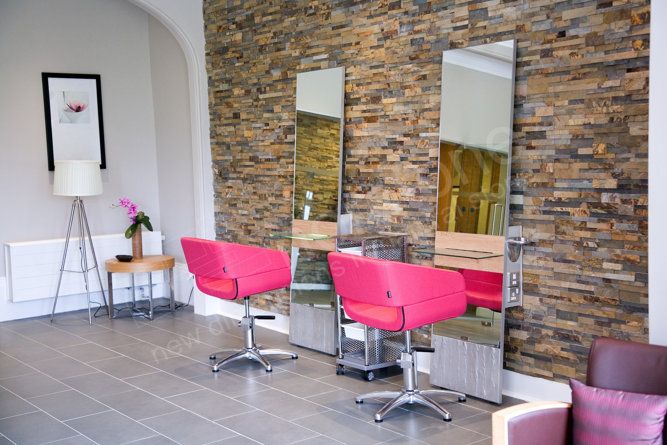 Natural Stacked Stone Panels used on the feature wall in a small hair salon with two chairs and two large mirrors